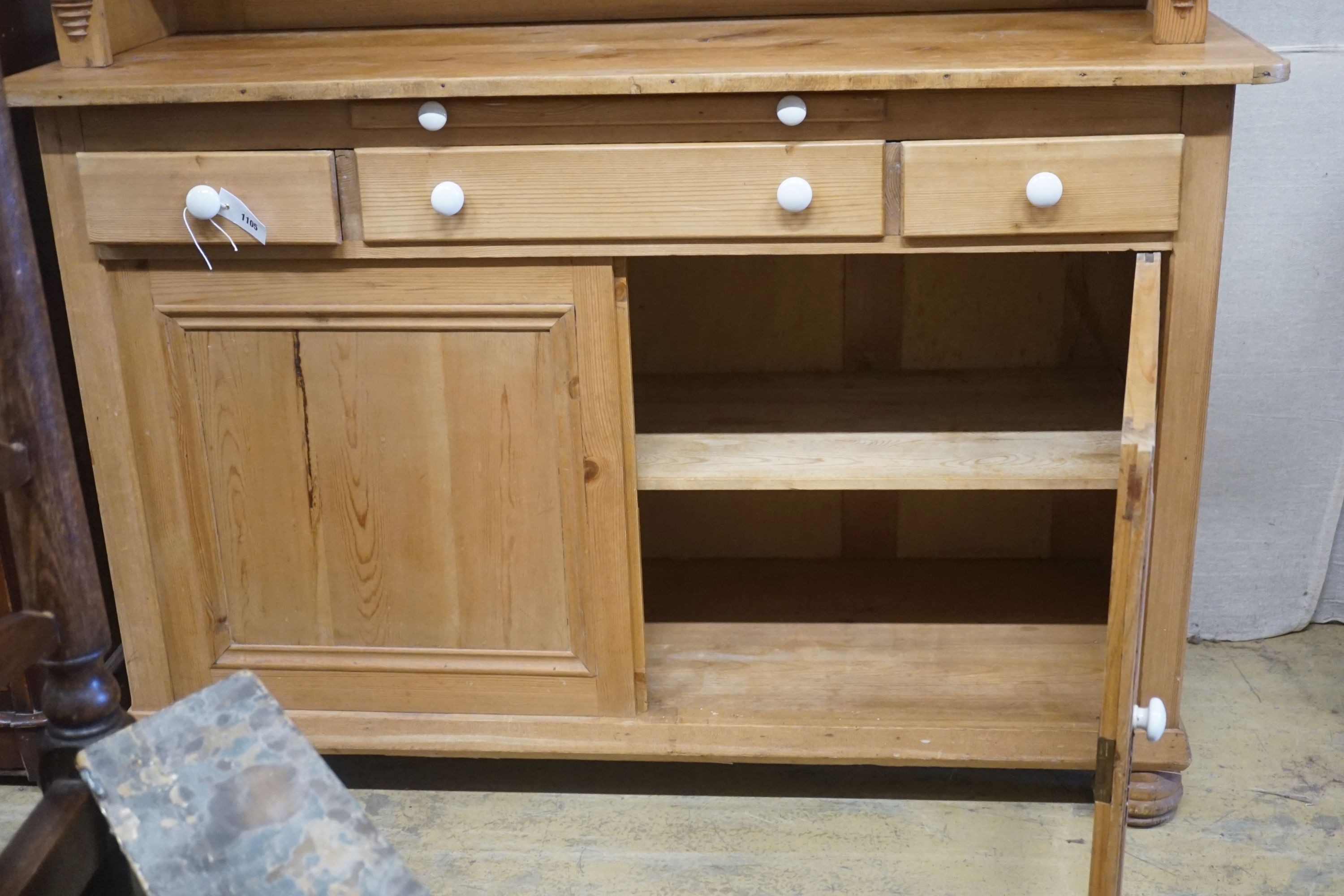 A 19th century Continental pine glazed side cabinet, width 142cm, depth 55cm, height 180cm